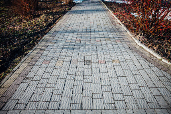 Paving stones of various colors, walking path in park
