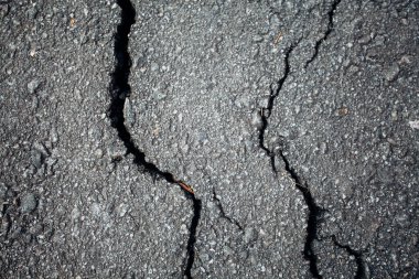 Çatlaklı asfalt yol. Arkaplan dokusu