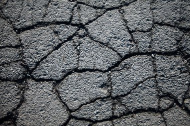 Çatlaklı asfalt yol. Arkaplan dokusu