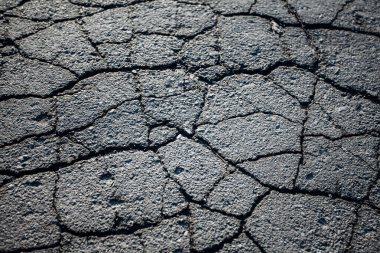 Çatlaklı asfalt yol. Arkaplan dokusu