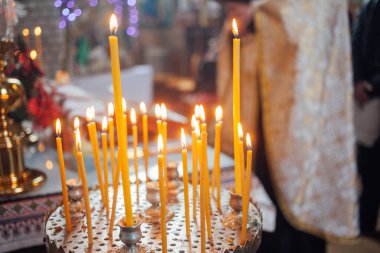 Closeup of candles in church
