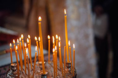 Closeup of candles in church