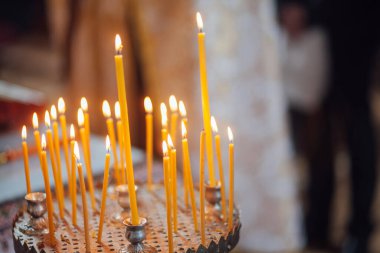 Closeup of candles in church