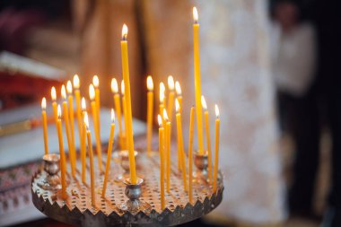 Closeup of candles in church