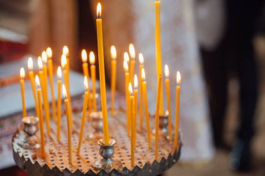 Closeup of candles in church