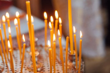 Closeup of candles in church