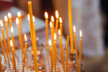 Closeup of candles in church