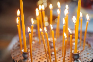 Closeup of candles in church
