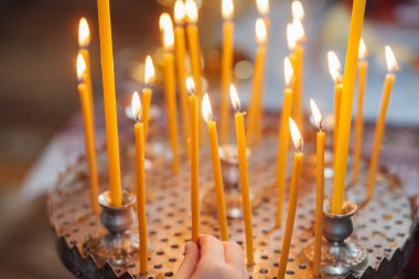 Closeup of candles in church