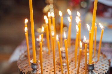 Closeup of candles in church
