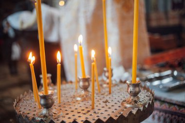Closeup of candles in church