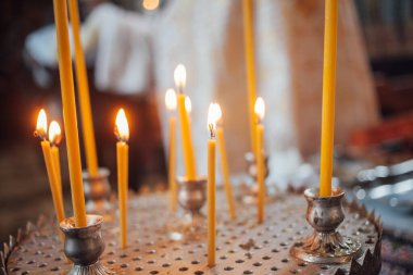 Closeup of candles in church