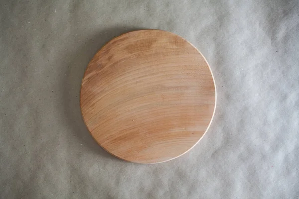 Round wooden board isolated on white background