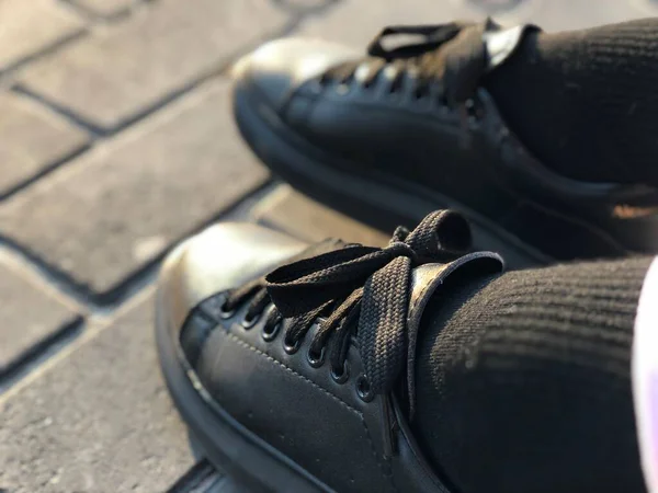 Unisex Black Shoes Pavers Closeup — Stock Photo, Image