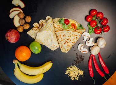 French pancakes dish with ingredients on dark background 