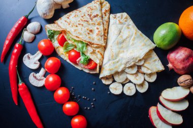 French pancakes dish with ingredients on dark background 