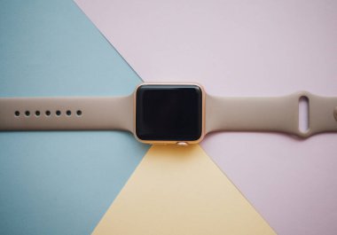 Smart watch on a colored background