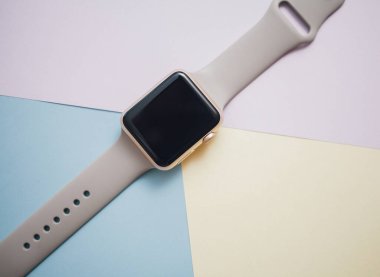 Smart watch on a colored background