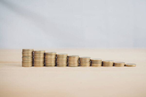 Coins stack step up growing growth saving money. Concept financial business investment