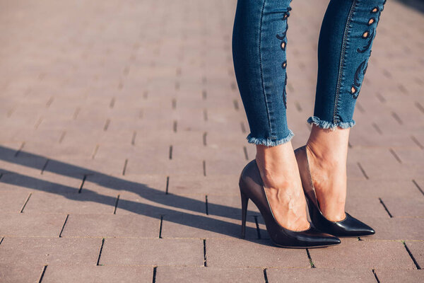 Woman in black high-heels. Closeup of female legs in high heels