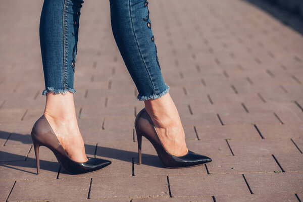 Woman in black high-heels. Closeup of female legs in high heels