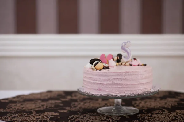 Tasty pink cake, closeup of decorated dessert