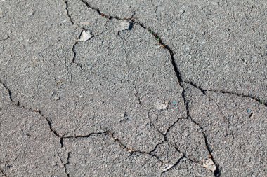 Çatlaklı asfalt yol. Arkaplan dokusu