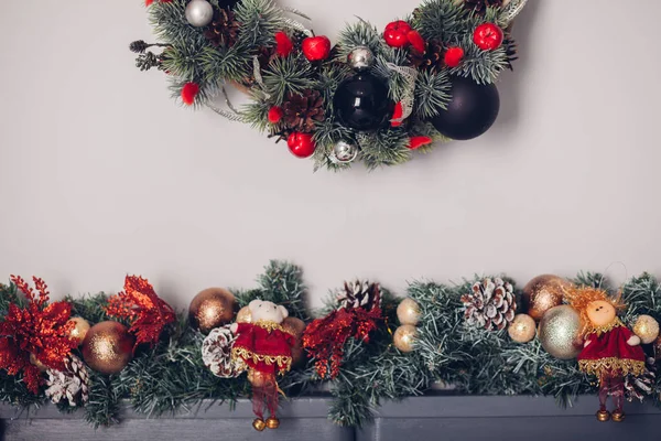 Bedroom decorated by Christmas. Cozy light interior, New Year\'s fir-tree decorated with toys and garlands