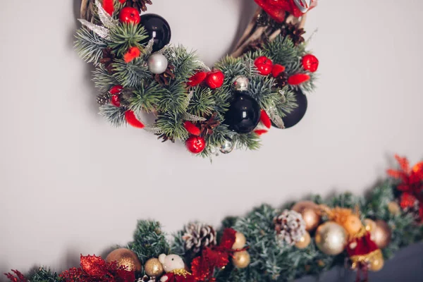 Bedroom decorated by Christmas. Cozy light interior, New Year\'s fir-tree decorated with toys and garlands