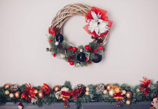 Bedroom decorated by Christmas. Cozy light interior, New Year\'s fir-tree decorated with toys and garlands