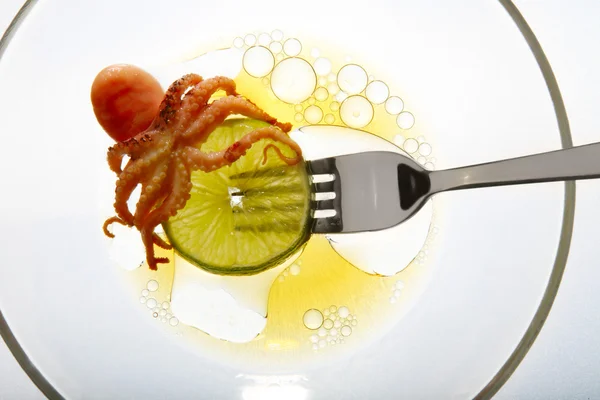 Small octopus on fork — Stock Photo, Image