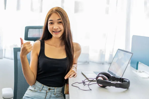 Smiling Positive Happy Young Asian Woman Using Laptop Computer Doing — стоковое фото