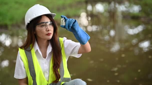 Female Ecologist Working Lake Taking Water Tests — Stock Video