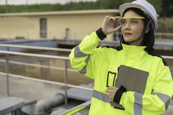 Environmental engineer working at wastewater treatment plant, Water recycling plant for reuse