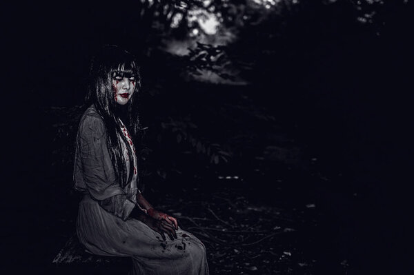 Portrait of asian woman make up ghost face, zombie, Halloween concept