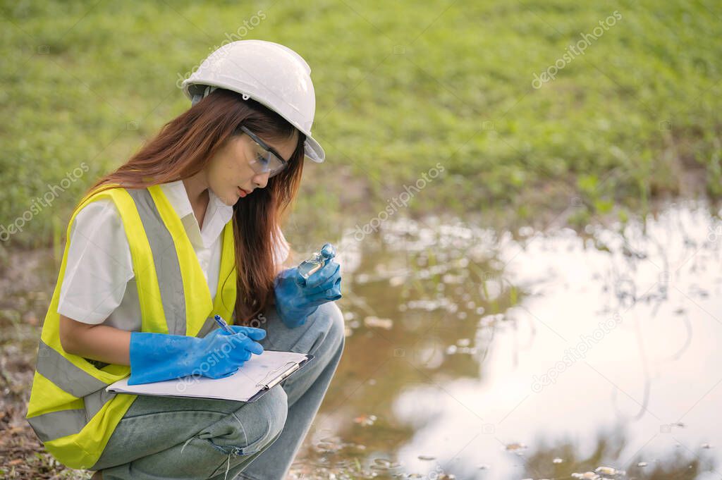 Environmental engineer inspecting water quality, checking the mineral content in water and soil