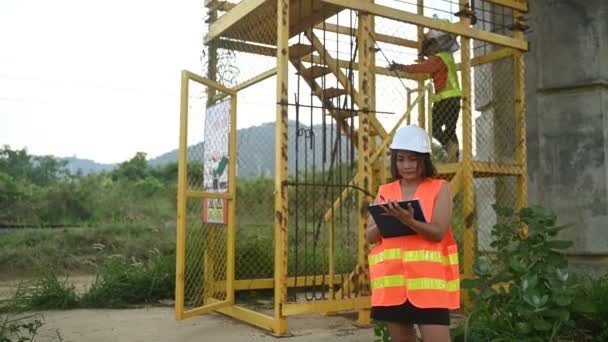 Asian Female Engineer Works Motorway Bridge Construction Site Civil Worker — Stock Video