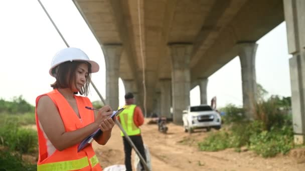 Asian Female Engineer Works Motorway Bridge Construction Site Civil Worker — Stockvideo