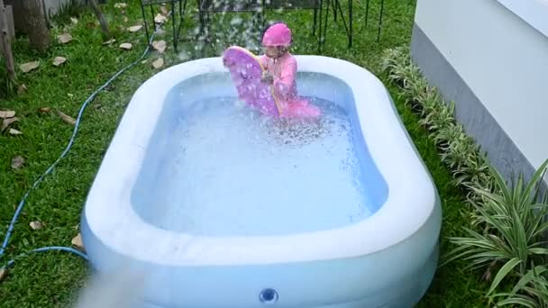 Asian Little Girl Swimming Inflatable Pool Home Fun — 图库视频影像