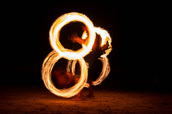 Open the long exposure of the swing fire at night.