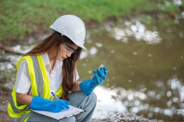 Environmental engineers inspect water quality,Bring water to the lab for testing,Check the mineral content in water and soil,Check for contaminants in water sources. clipart