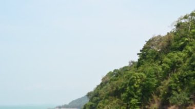 Beautiful view of road between mountains and sea