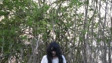 Portrait of asian woman make up ghost face at the swamp, Horror in water scene, Scary at river, Halloween poster, Thailand people