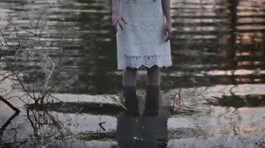 Portrait of asian woman make up ghost face at the swamp, Horror in water scene, Scary at river, Halloween poster, Thailand people