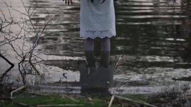 Portrait of asian woman make up ghost face at the swamp, Horror in water scene, Scary at river, Halloween poster, Thailand people