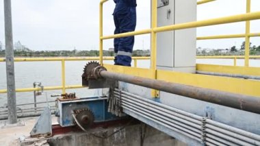 Water plant maintenance technician, mechanical engineer check the control system at the water treatment plant