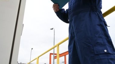 Water plant maintenance technician, mechanical engineer check the control system at the water treatment plant