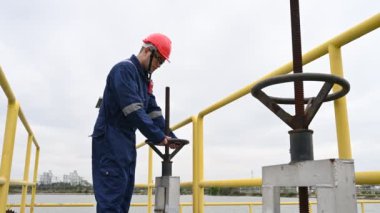 Water plant maintenance technician, mechanical engineer check the control system at the water treatment plant