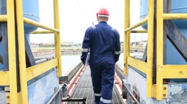 Water plant maintenance technician, mechanical engineer check the control system at the water treatment plant