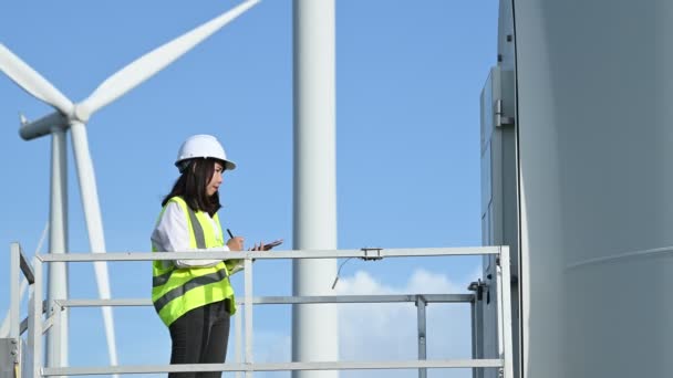 Woman Engineer Working Holding Report Wind Turbine Farm Power Generator — Stock Video